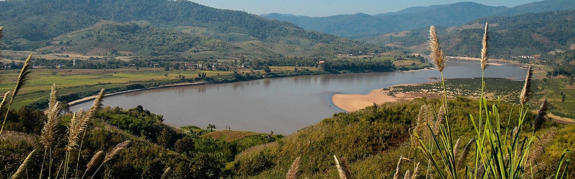 Mekong River sunset in Chiang Khong on a scenic Chiang Khong Travel banner by Legend Travel Group.